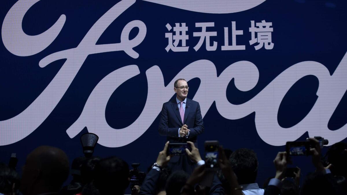 Peter Fleet, president and CEO of Ford China, speaks during an April 2018 launch event at the Beijing auto show.