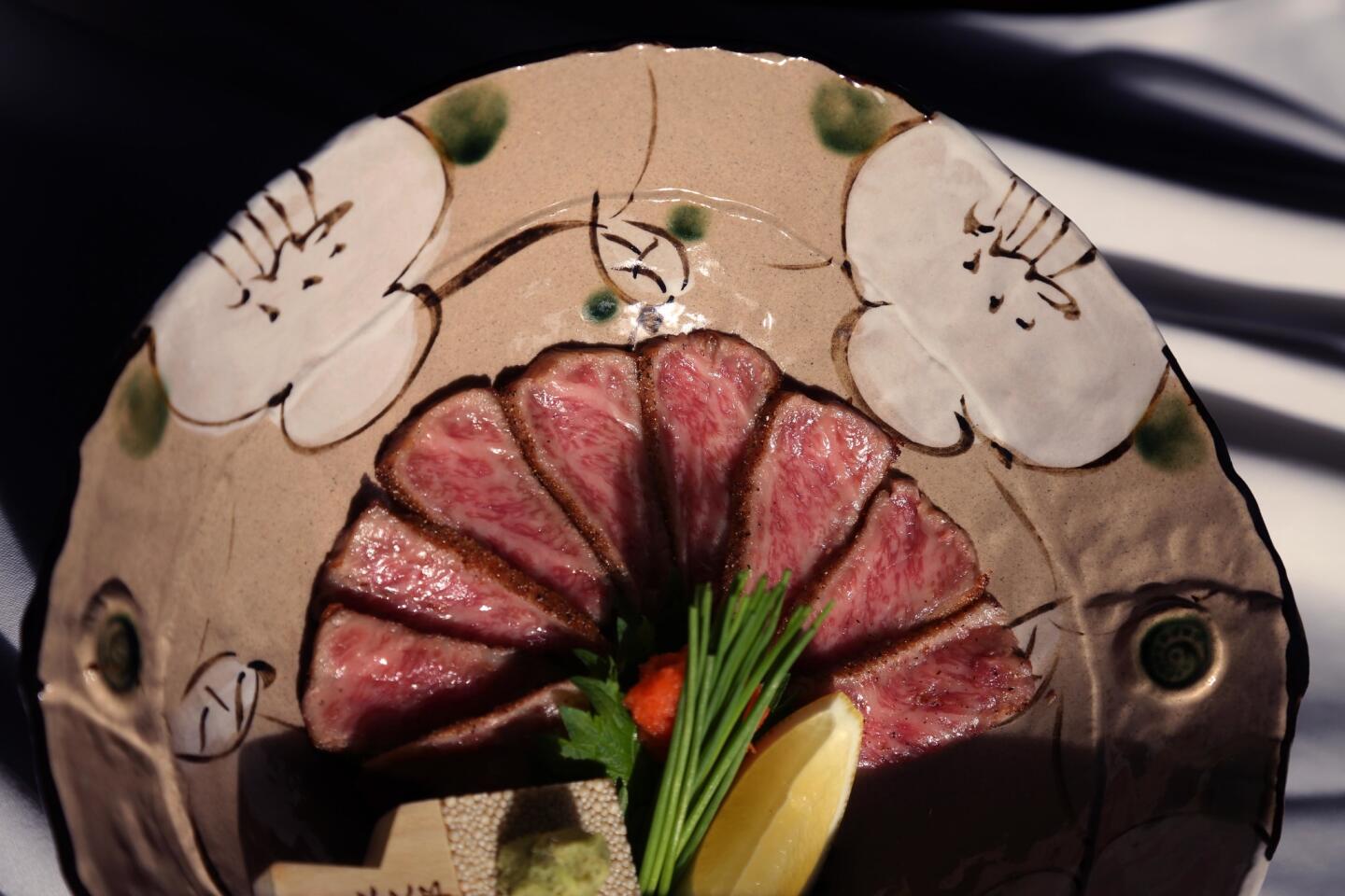 Wagyu beef tataki with fresh wasabi. The meat is lightly seared, marinated and sliced thinly, similar to sashimi.