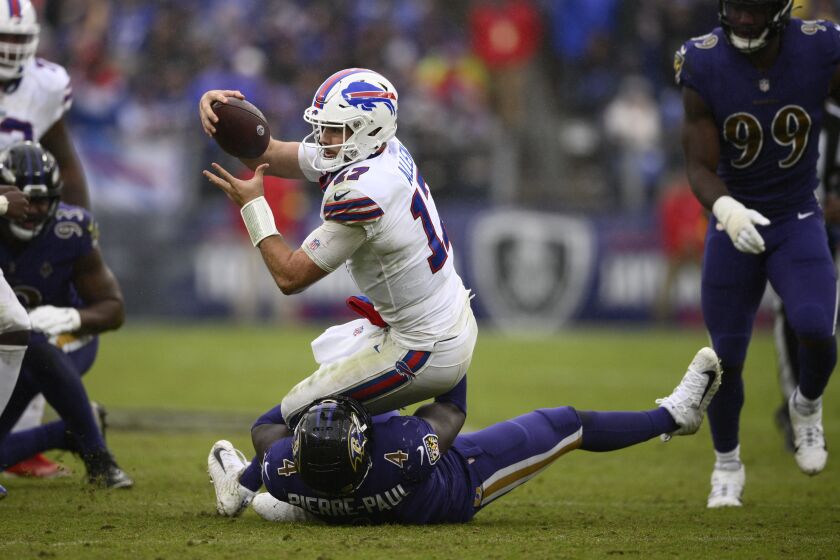 Buffalo Bills quarterback Josh Allen (17) is brought down by Baltimore Ravens linebacker Jason Pierre-Paul (4) in the second half of an NFL football game Sunday, Oct. 2, 2022, in Baltimore. (AP Photo/Nick Wass)