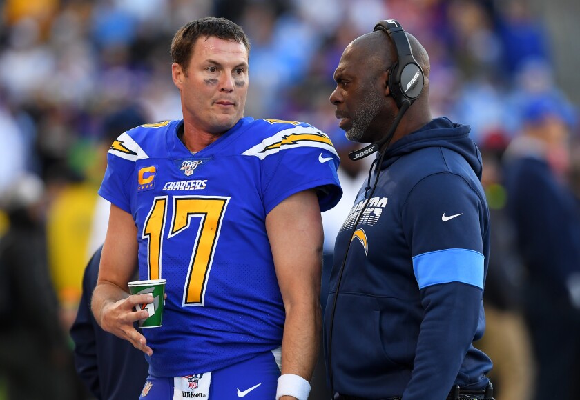 Chargers quarterback Philip Rivers, left, and coach Anthony Lynn talk on the sideline.