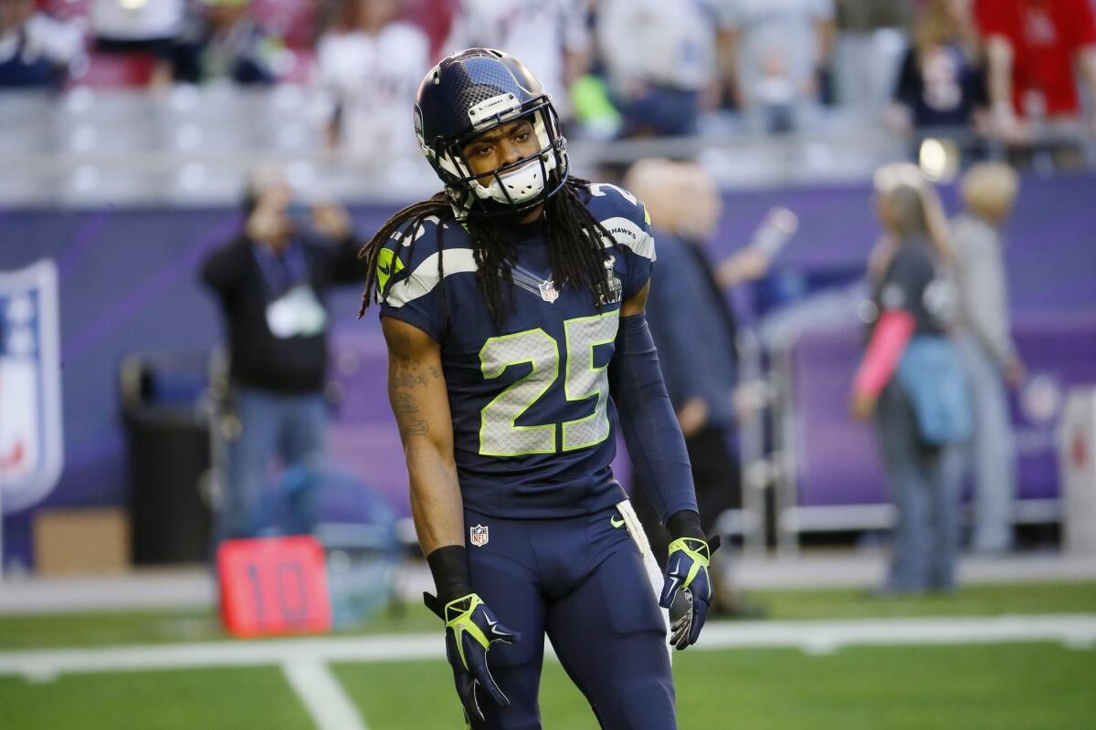 Seattle cornerback Richard Sherman warms up before Super Bowl XLIX n Glendale, Ariz., on Feb. 1.