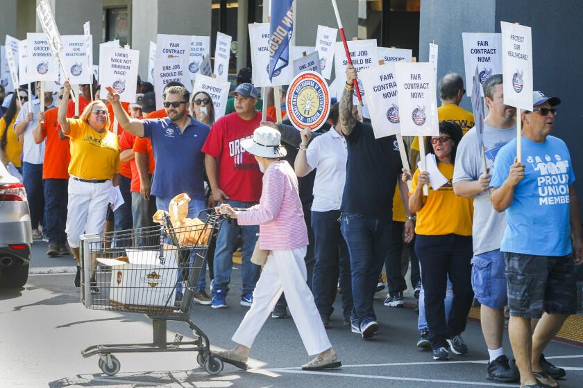 Members of the UFCW (United Food and Commercial Workers) Local 135 and members of several other supporting labor unions rally outside the Ralphs grocery store on Mission Center Road in Mission Valley on August 16, 2019 in San Diego, California. The labor unions are unhappy with the progress of talks for a new contract for grocery workers.