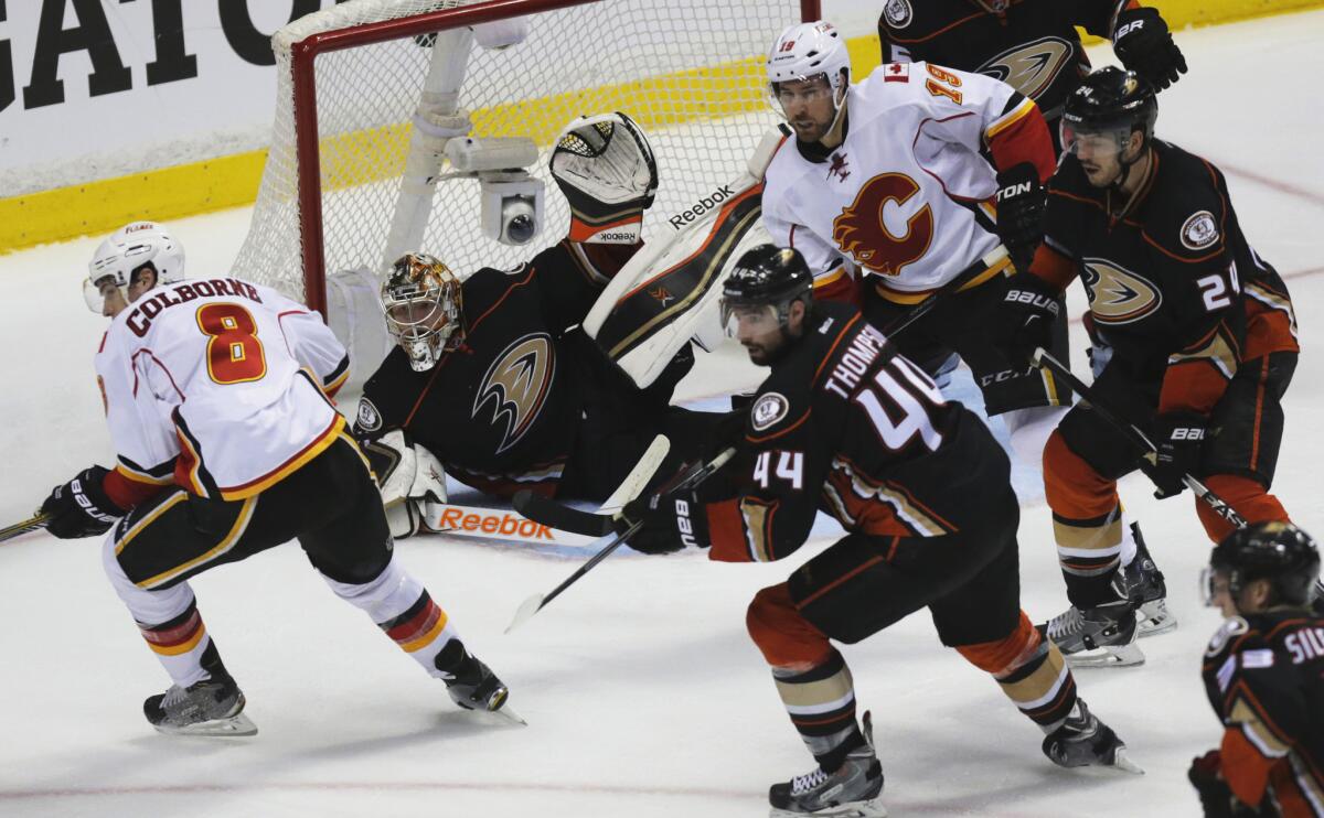 Ducks goalie Frederik Andersen turns away a shot by the Flames in the third period of Game 1 on Thursday night at Honda Center.