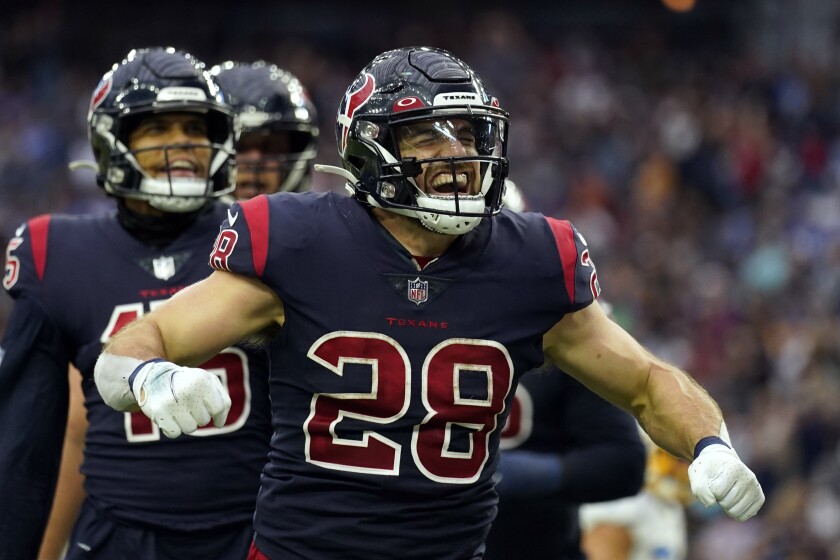 Texans running back Rex Burkhead (28) celebrates a touchdown run against the Chargers.