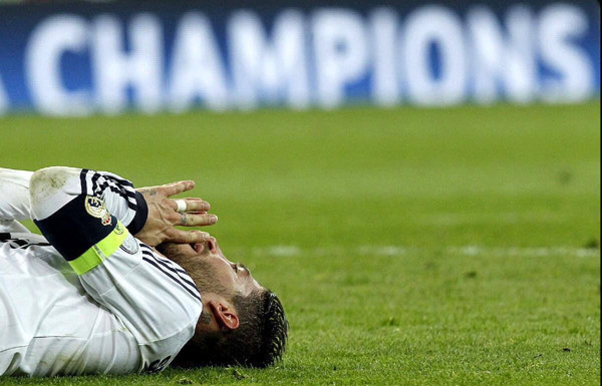 Real Madrid defender Sergio Ramos falls to the pitch after Borussia Dortmund defeated the Spanish club in the Champions League semifinals.
