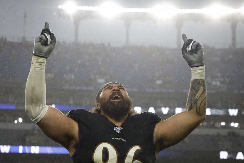 Domata Peko Sr. of the Baltimore Ravens celebrates after a game against the San Francisco 49ers in 2019.