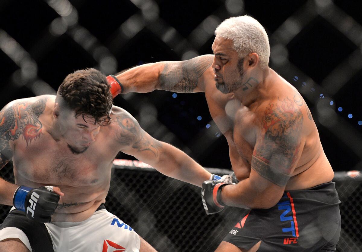 Mark Hunt delivers the knockout punch against Frank Mir during their UFC heavyweight fight at UFC Brisbane.
