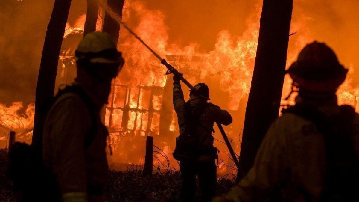 Firefighters battle the Camp fire in Butte County, Calif., on Nov. 9.