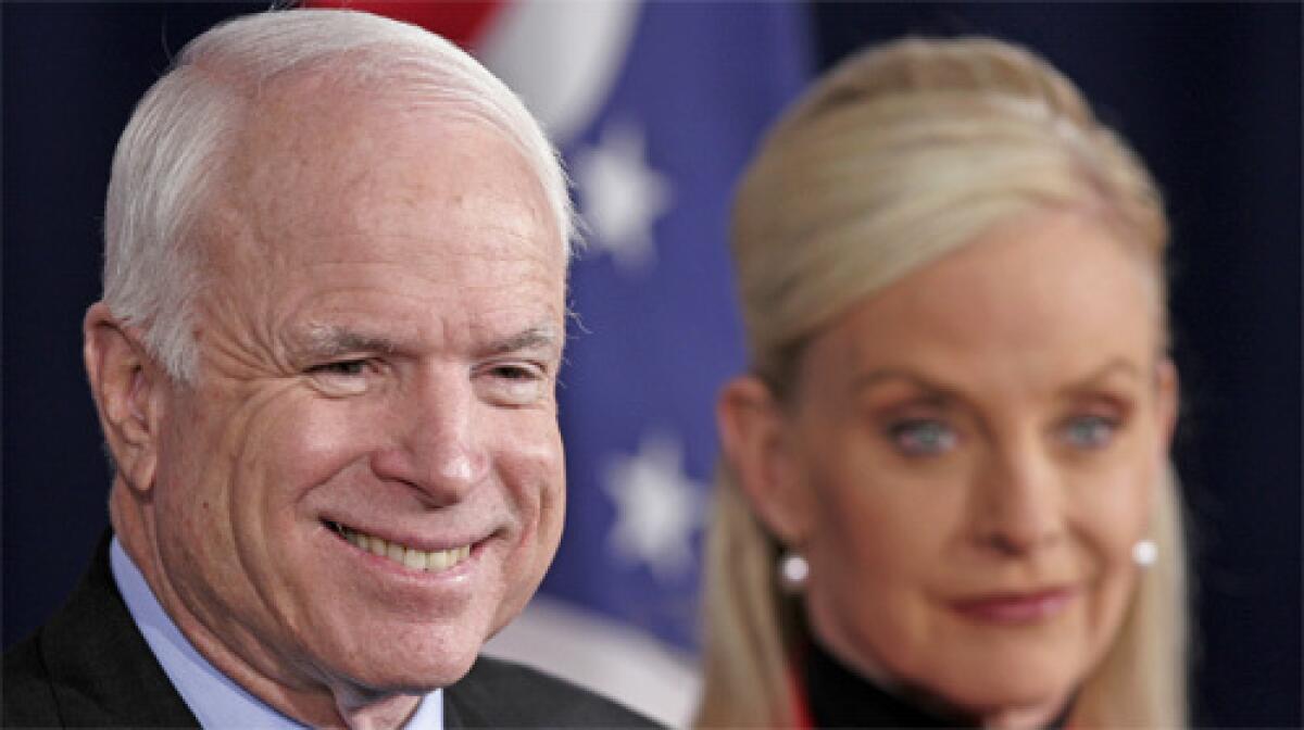 Presidential hopeful, Sen. John McCain, left, speaks at a news conference in Columbus, Ohio with his wife, Cindy.