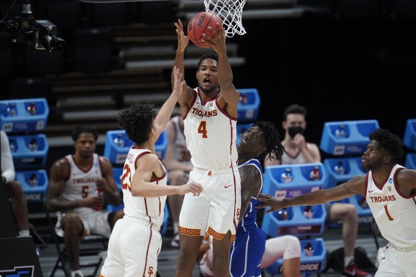 USC's Evan Mobley grabs a rebound against Drake during an NCAA tournament first-round game March 20, 2021.