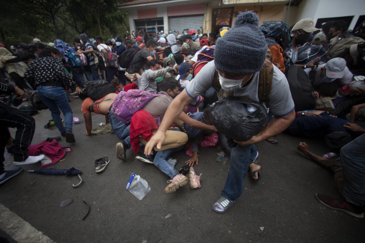 Honduran migrants hoping to reach the U.S. scramble to cross the Honduras-Guatemala border.