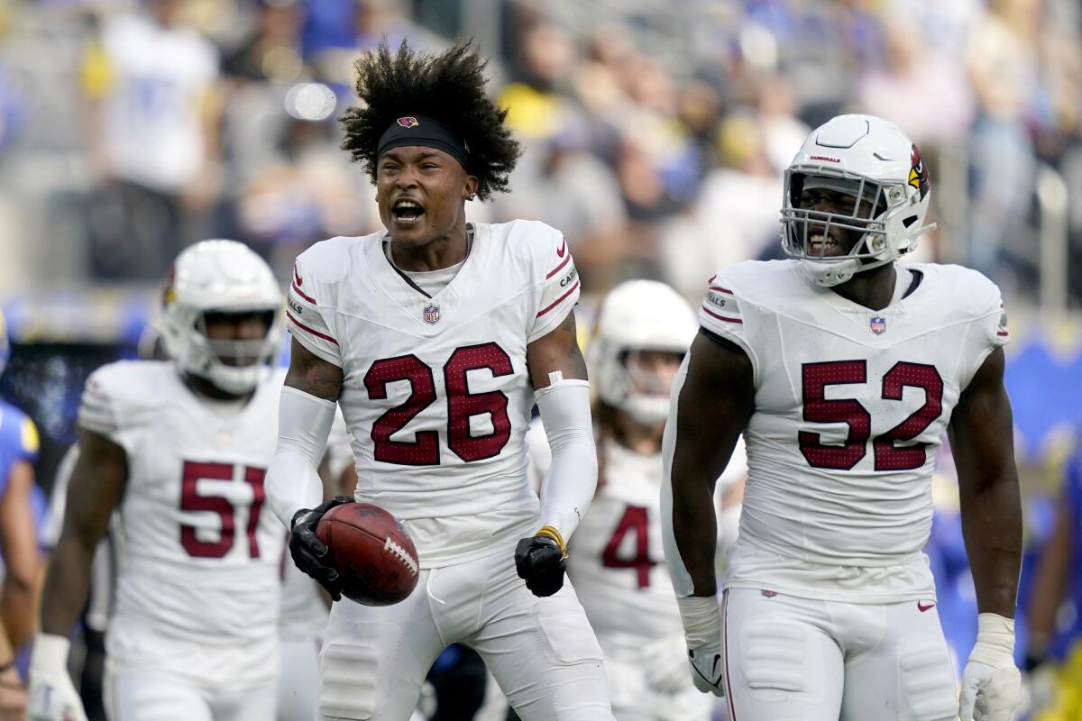 Arizona Cardinals cornerback Bobby Price celebrates after recovering a Rams fumble on a punt return in the first half.