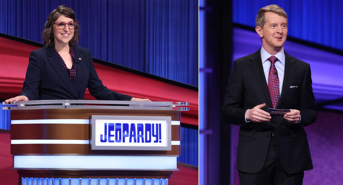 A split image of Mayim Bialik in a blue suit at a lectern and Ken Jennings in a dark suit holding index cards on 'Jeopardy!'