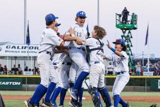 Pitcher Jaxon Kalish (center) gets surrounded after the final out of El Segundo 