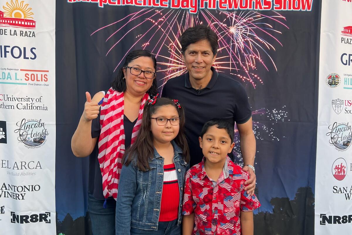 People enjoy Lincoln Heights July Fourth event in Lincoln Heights including City Councilmember Kevin de León, center.