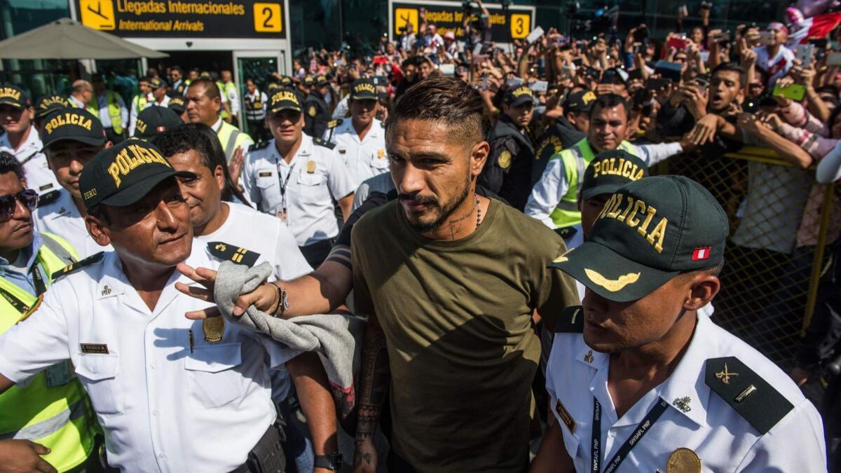 Peruvian football star Paolo Guerrero at an airport in Lima on Monday, a day after the Court of Arbitration for Sport extended a doping ban imposed on him.