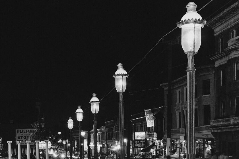 FILE - Gas lamps illuminate St. Louis' Gaslight Square on April 2, 1962. "Gaslighting" — mind manipulating, grossly misleading, downright deceitful — is Merriam-Webster's word of 2022. (AP Photo/JMH, File)