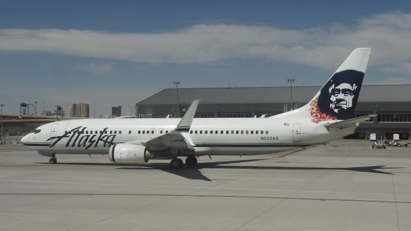 An Alaska Airlines passenger jet sits on the runway at McCarran International Airport in Las Vegas.