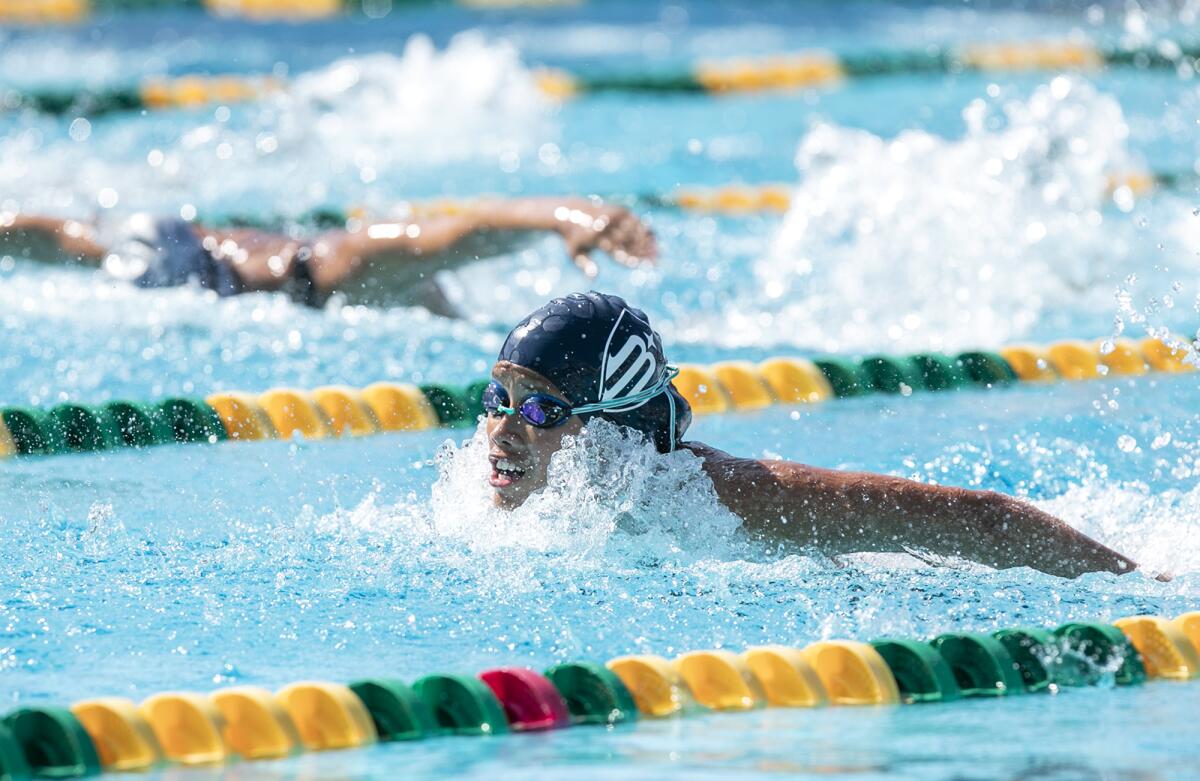 Marina's Alexandra Marumoto competes in the girls' 100-yard butterfly during the Wave League swimming finals on Thursday.