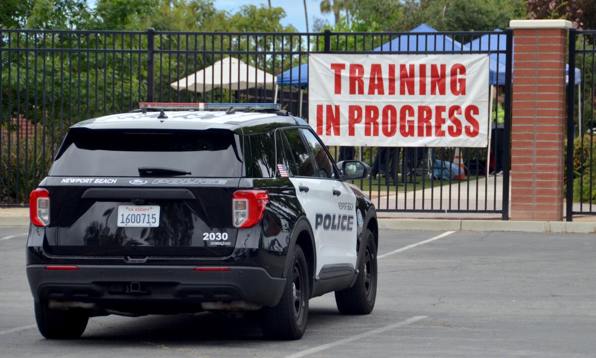A banner announces the NBPD training exercises June 13 and 14 at Corona del Mar High School.