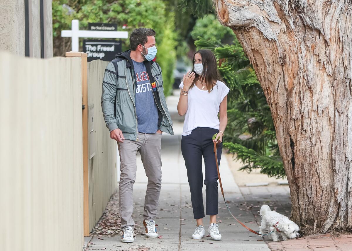 Ben Affleck and Ana de Armas walk a dog during the pandemic.