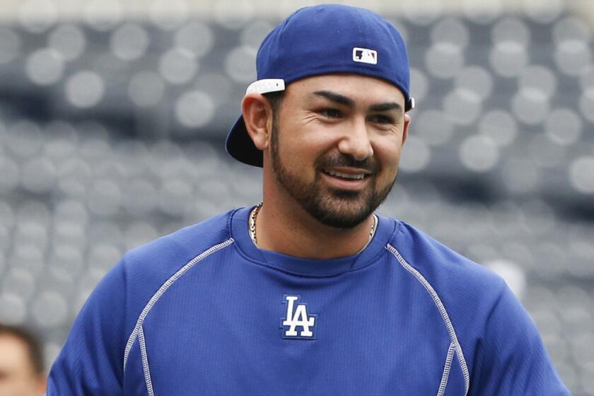 Los Angeles Dodgers first baseman Adrian Gonzalez smiles during warmups before a game against the San Diego Padres on Friday.