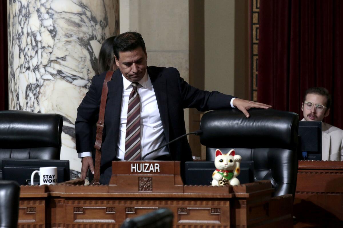 Los Angeles City Councilman Jose Huizar, appearing at a council meeting last year, had been seeking an indefinite delay in the proceedings of lawsuits filed by his former staffers.