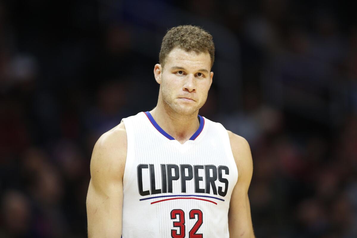 Clippers power forward Blake Griffin walks on the court against the Portland Trail Blazers on Nov. 30.