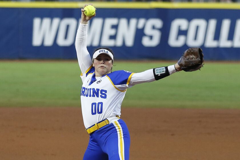 UCLA's Rachel Garcia pitches in the first inning of an NCAA Women's College World Series.