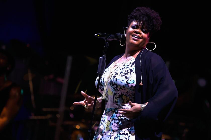 Jill Scott, seen performing last month in Cincinnati, topped the Billboard 200 chart this week with her new album, "Woman."