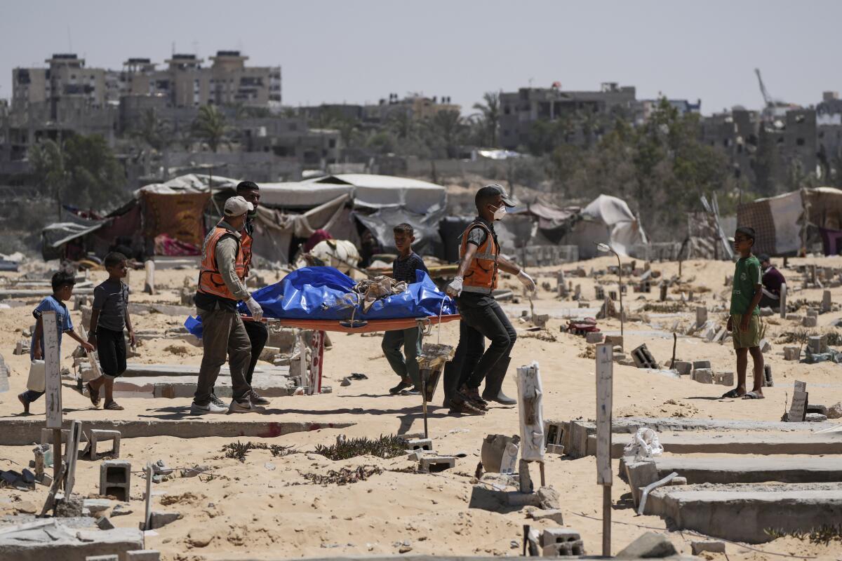 People carry a long blue bag.