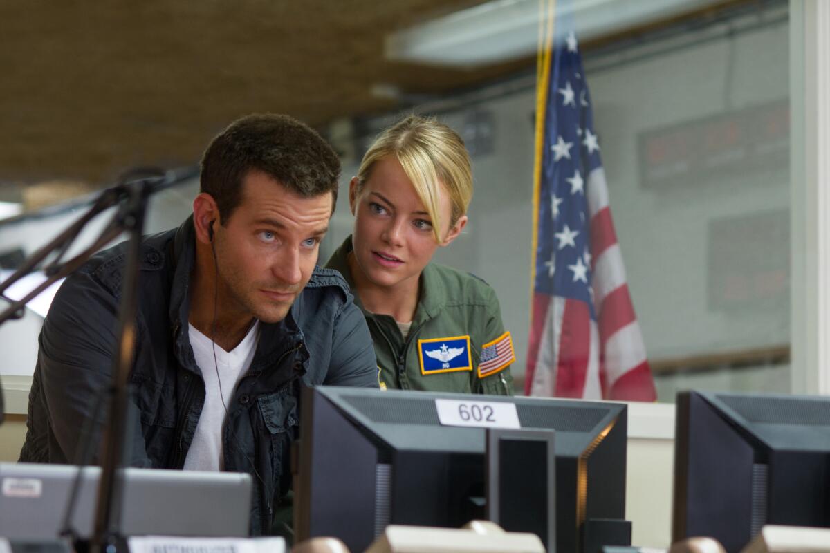 Bradley Cooper, left, and Emma Stone, in a scene from Columbia Pictures' "Aloha."