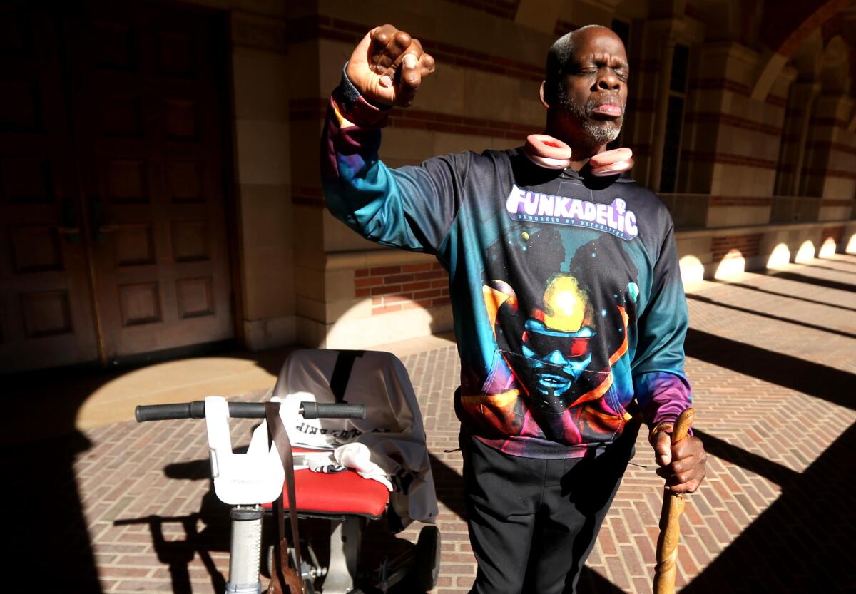 Disabled scholar and community activist Leroy Moore raises a defiant fist in support of disability rights.