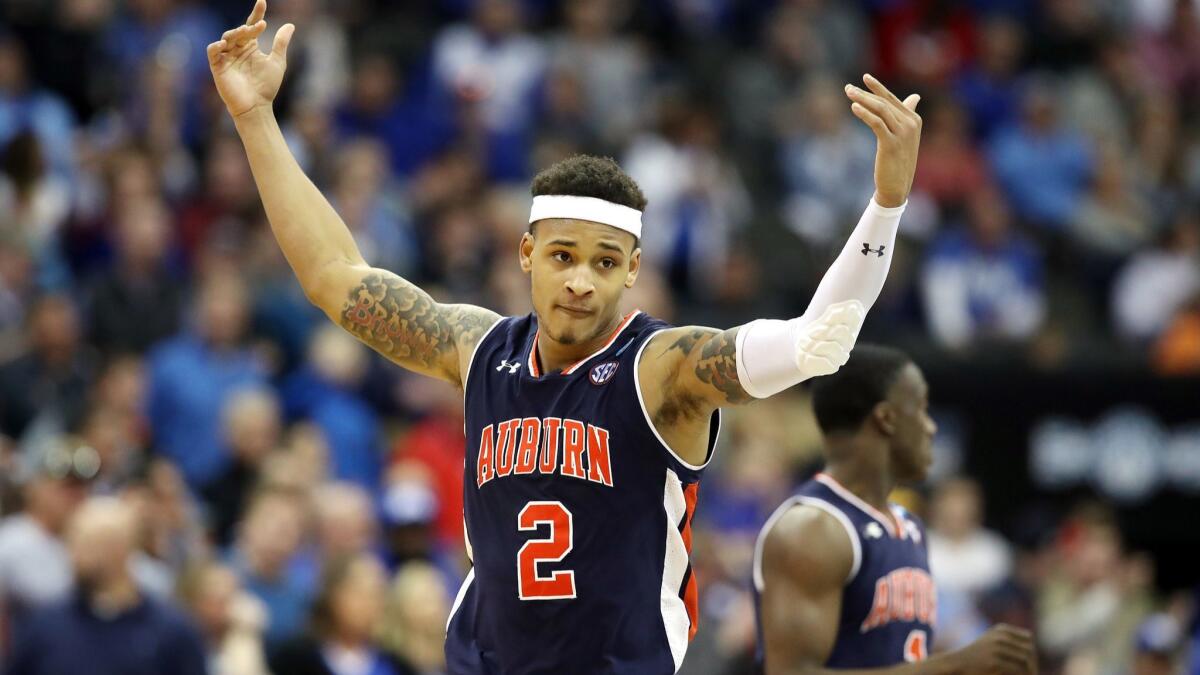Auburn guard Bryce Brown celebrates after scoring against Kentucky during the Midwest Regional final on Sunday.