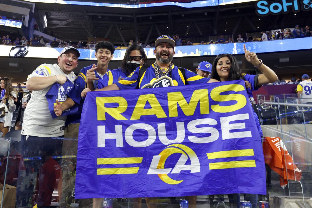 Los Angeles Rams fans display their Rams House banner.
