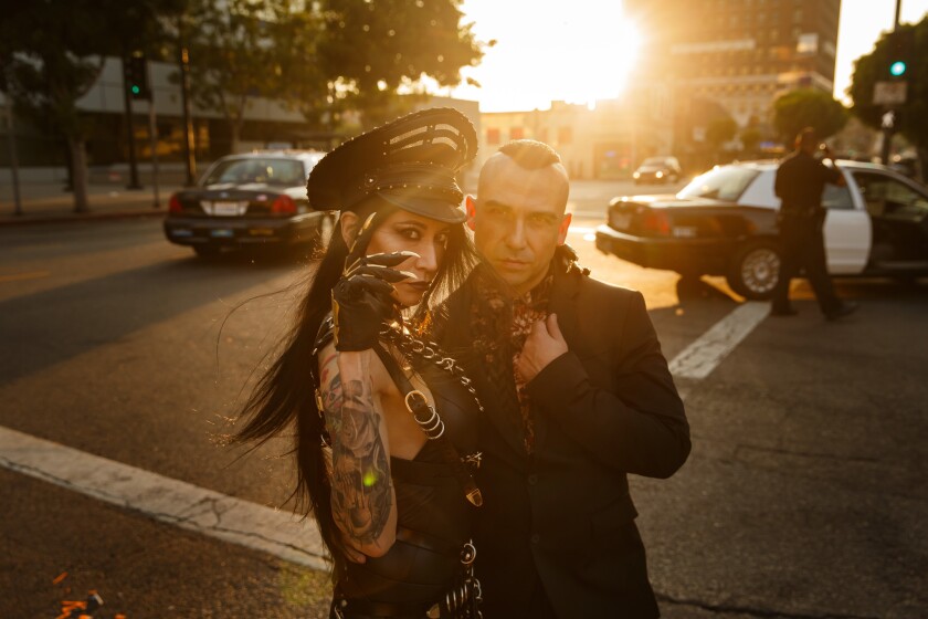Artist Lizz Lopez poses with Danny Fuentes for a portrait before her solo show "Muerte," at Lethal Amounts in Los Angeles.