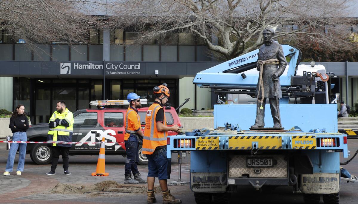 A bronze statue of British Capt. John Hamilton is removed in New Zealand.
