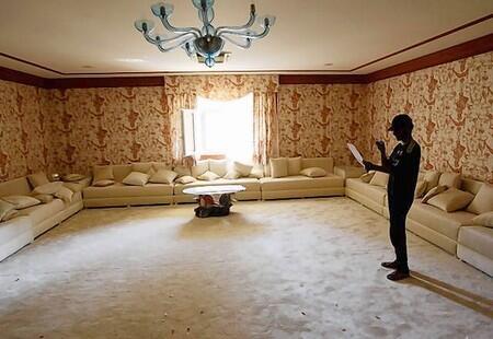 A man stands inside a house of Aisha daughter of Libyan leader Muammar Gaddafi in Tripoli.