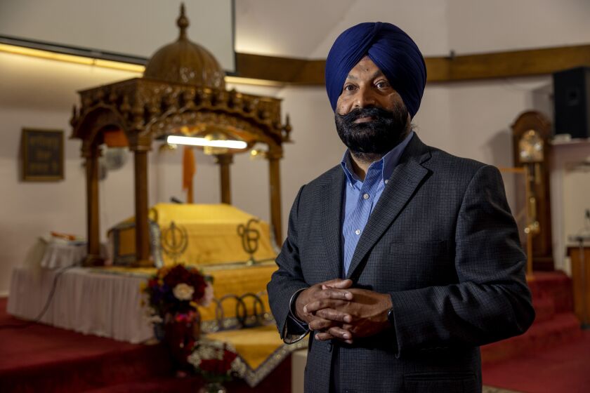 POWAY, CA - MARCH 31, 2022: Manjit Singh Gill, who is on the board of directors at The Sikh Foundation, stands near where holy scriptures are kept in Diwan Hall at The Sikh Foundation in Poway on Thursday, March 31, 2022. (Hayne Palmour IV / For The San Diego Union-Tribune)