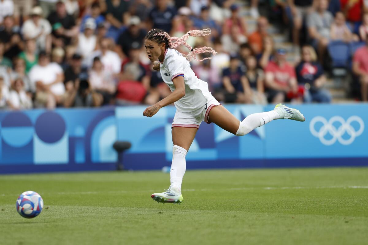 U.S. forward Trinity Rodman takes a shot during a 1-0 win over Japan in the Paris Olympics quarterfinals on Saturday.