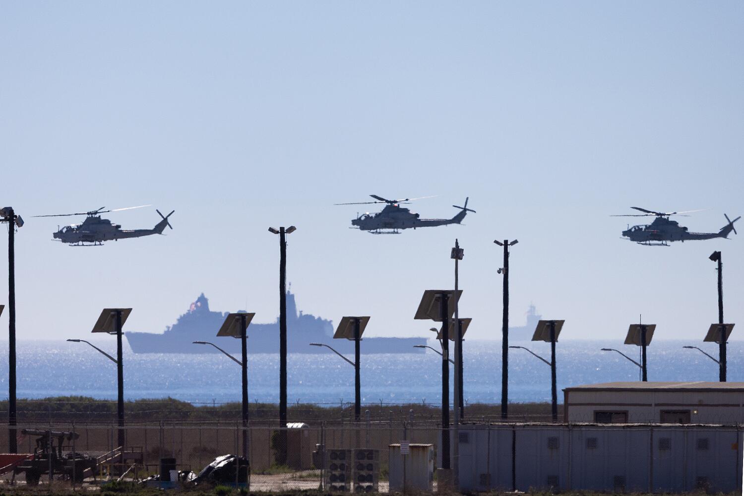 Camp Pendleton , California - October 18: Military helicopters aircraft fly over Camp Pendleton during a temporary closure of Interstate 5 after military officials confirmed that live-fire artillery rounds will be shot over the freeway, prompting state officials to shut down the freeway in an unprecedented move, at Camp Pendleton, California on October 18, 2025. (Jonathan Alcorn/ For The Times)