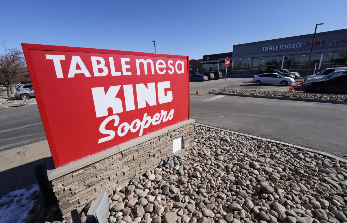 The new sign is displayed outside the Table Mesa King Soopers during a media tour Tuesday, Feb. 8, 2022, in Boulder, Colo. Ten people were killed inside and outside the store when a gunman opened fire on March 22, 2021. The store reopens with new renovations on Wednesday, Feb. 9. (AP Photo/David Zalubowski)