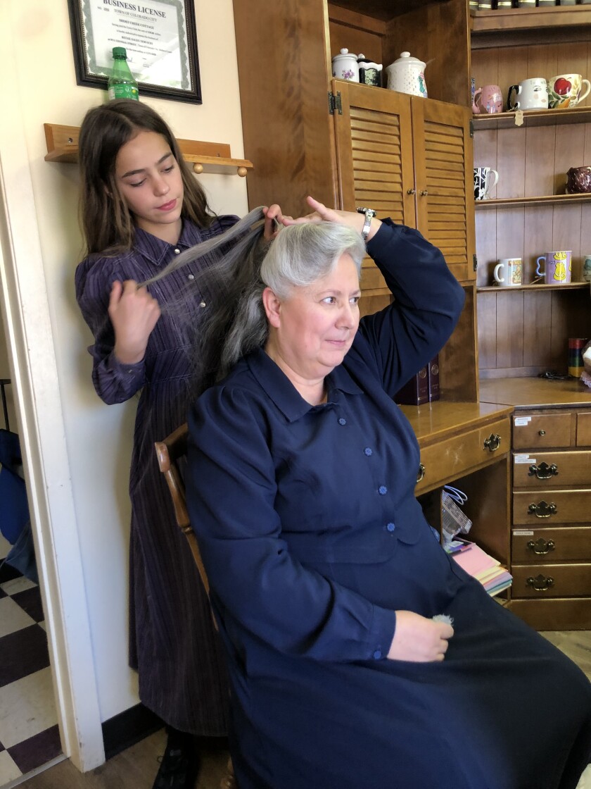 A woman getting her hair done