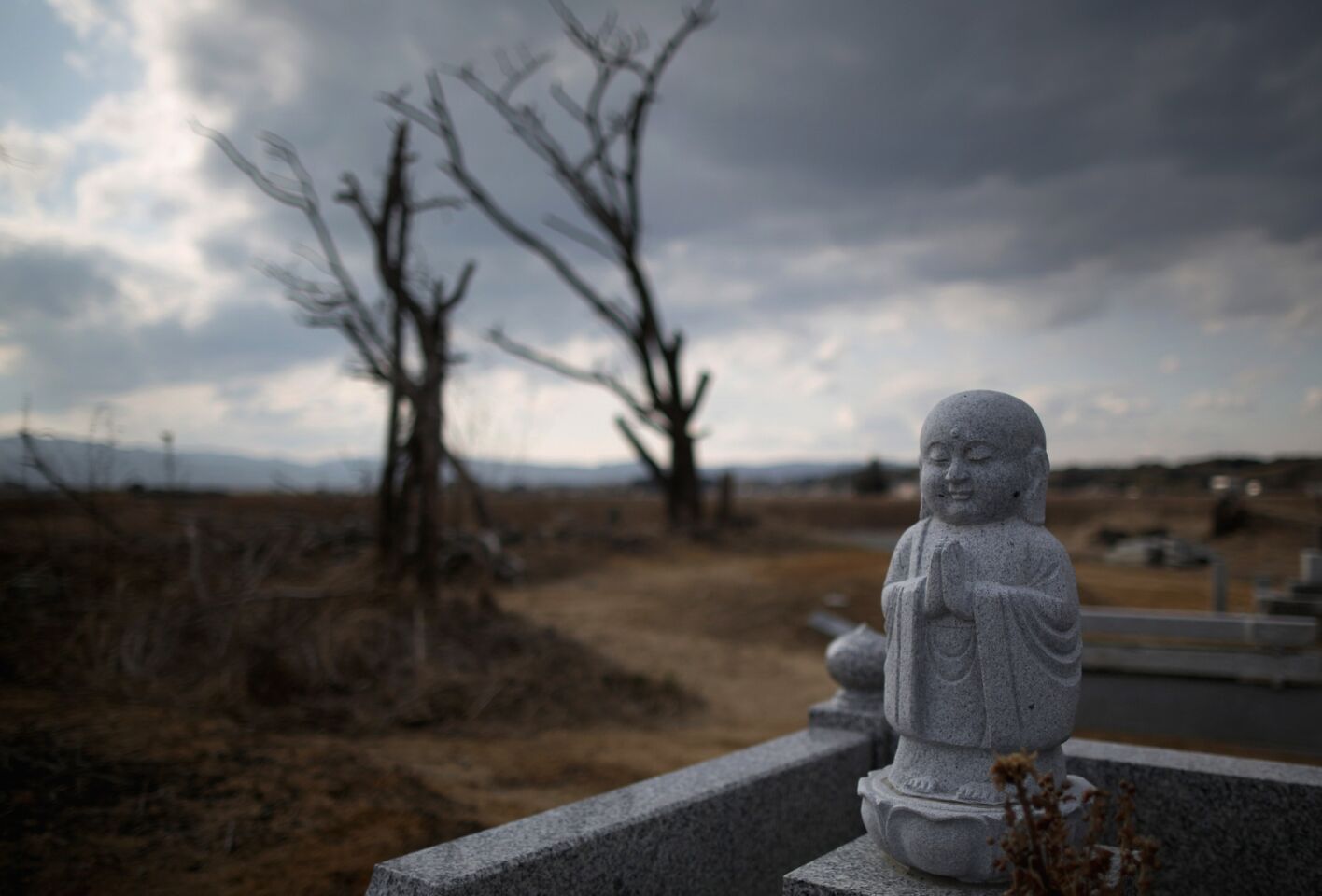 A graveyard stands in the tsunami-scarred landscape in Namie.