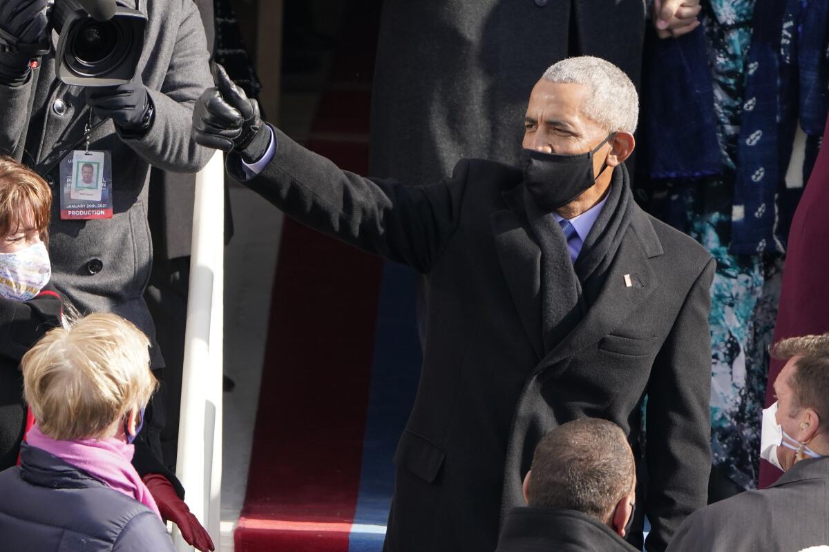 Former President Barack Obama gives a thumbs up after the presidential inauguration of Joe Biden.