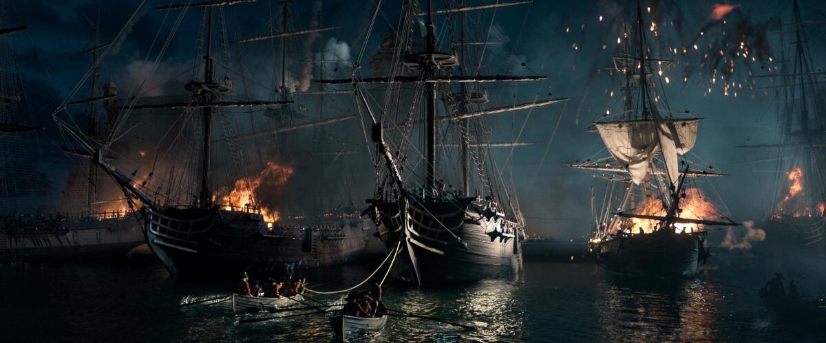 Ships in a harbor are damaged and aflame in "Napoleon."