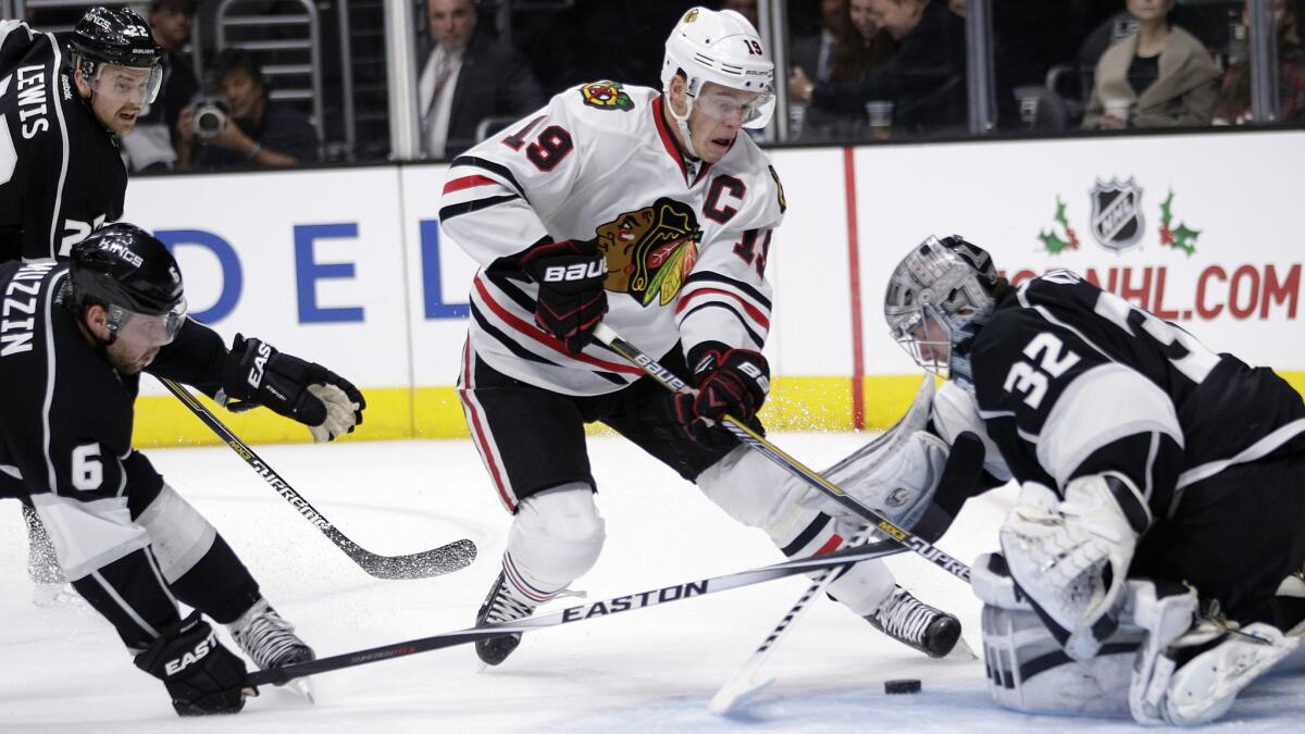 Kings goalie Jonathan Quick makes a save on a shot by Chicago Blackhawks captain Jonathan Toews during the first period of the Kings' 4-1 loss Saturday.