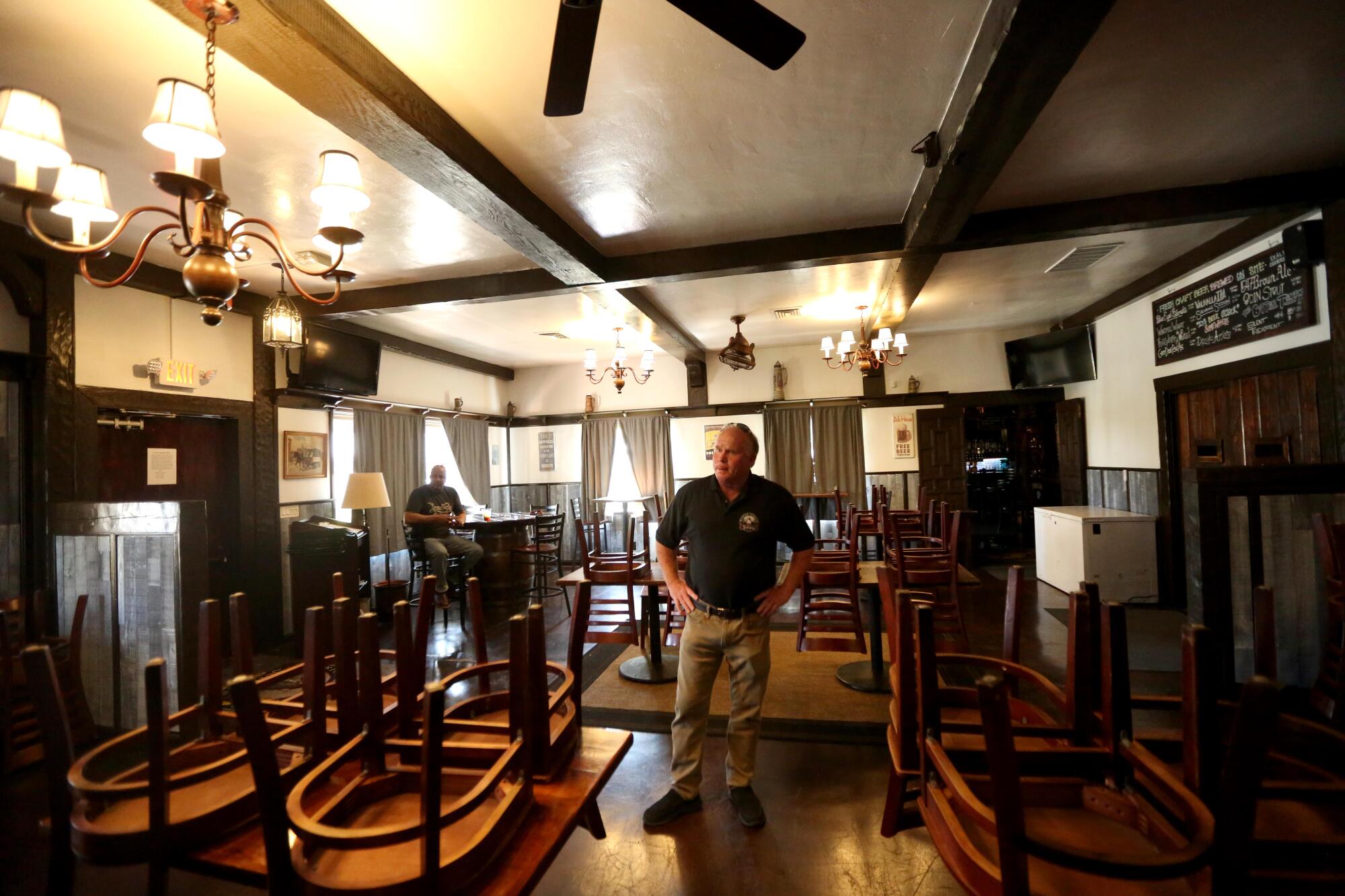 Bill Rodgers, co-owner of Solvang Brewing Co., stands inside the establishment, which has complied with the order that nonessential businesses close.