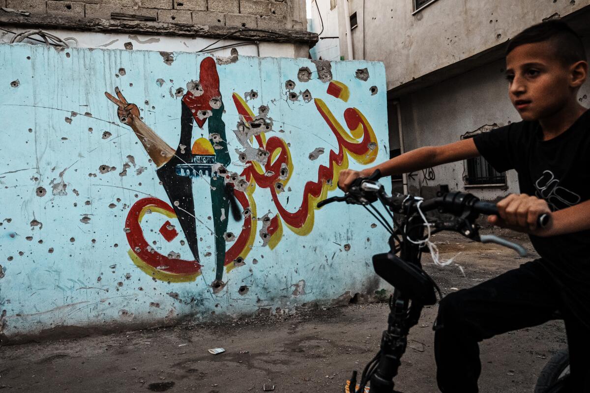 Child on a bike in Jenin, in the occupied West Bank