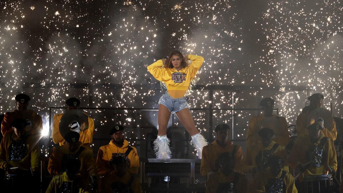 Beyoncé delivers a stunning show from the Coachella stage Saturday night with a little help from Jay-Z and Destiny's Child.